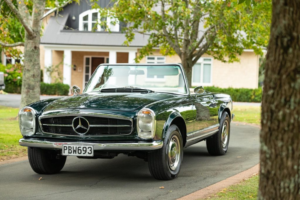 Mercedes-Benz 230 SL Pagoda parked in a courtyard