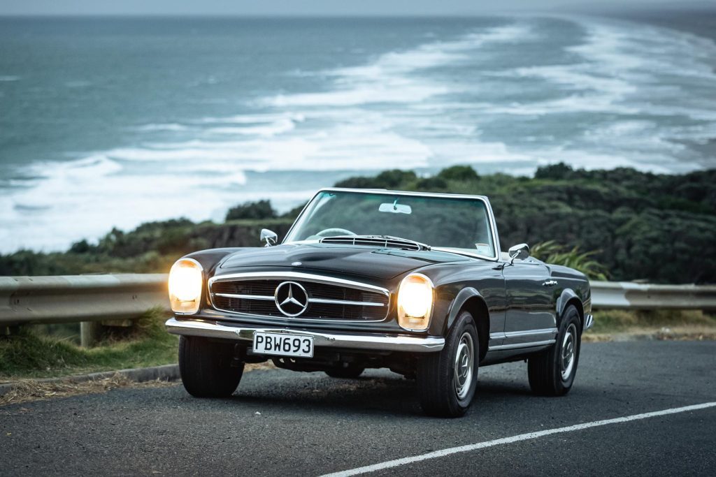 Mercedes-Benz 230 SL Pagoda front view, dark at Muriwai beach