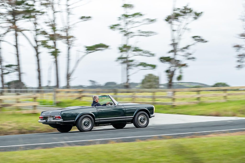 Side panning shot of the Mercedes-Benz 230 SL Pagoda, view from rear