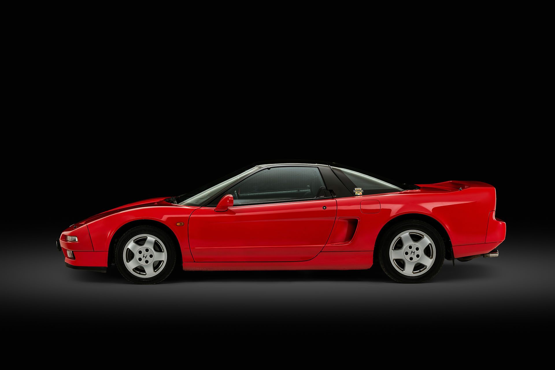 Senna's red NSX static in profile.