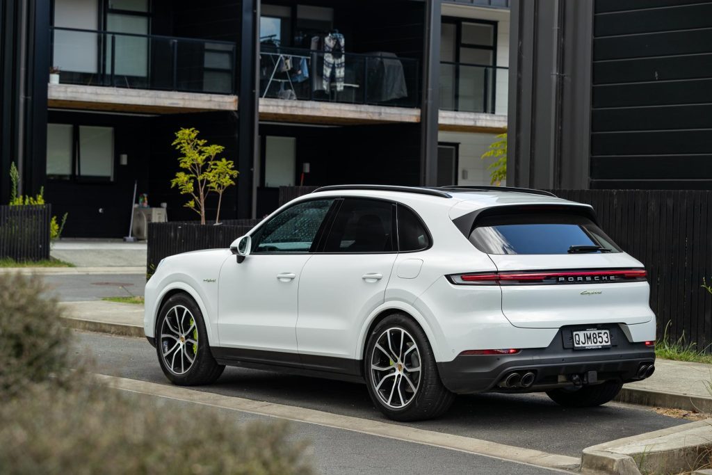 Porsche Cayenne E-Hybrid rear quarter static, parked near apartments