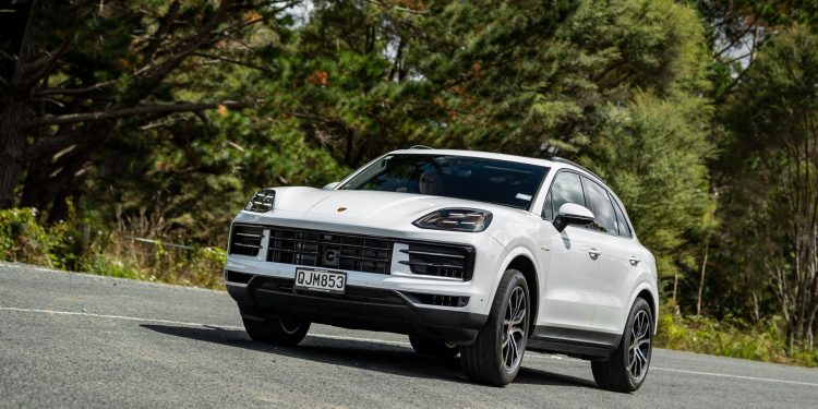 Porsche Cayenne e-Hybrid cornering at pace, shown from front