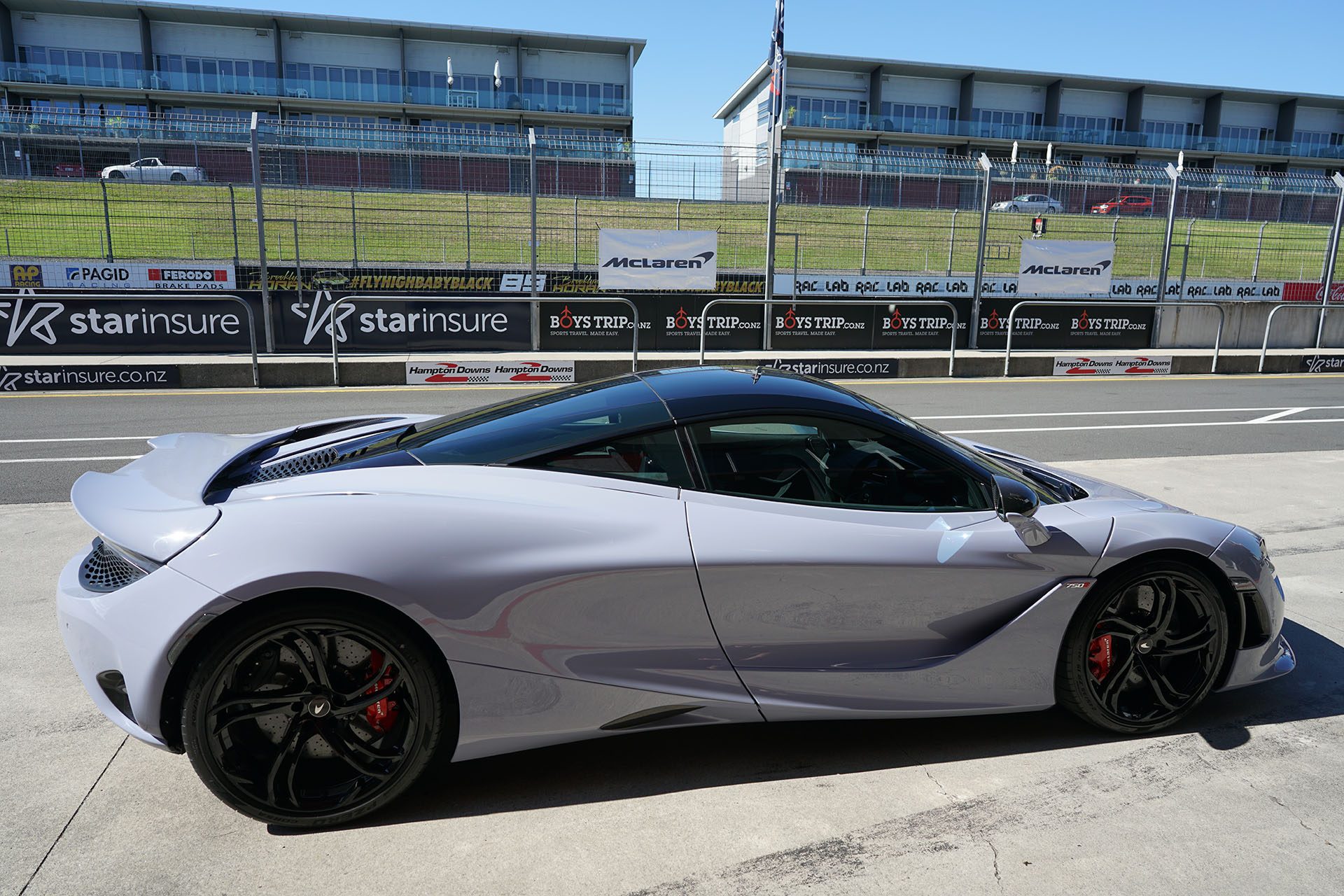 McLaren 750S awaits the day, curvy and grounded. 