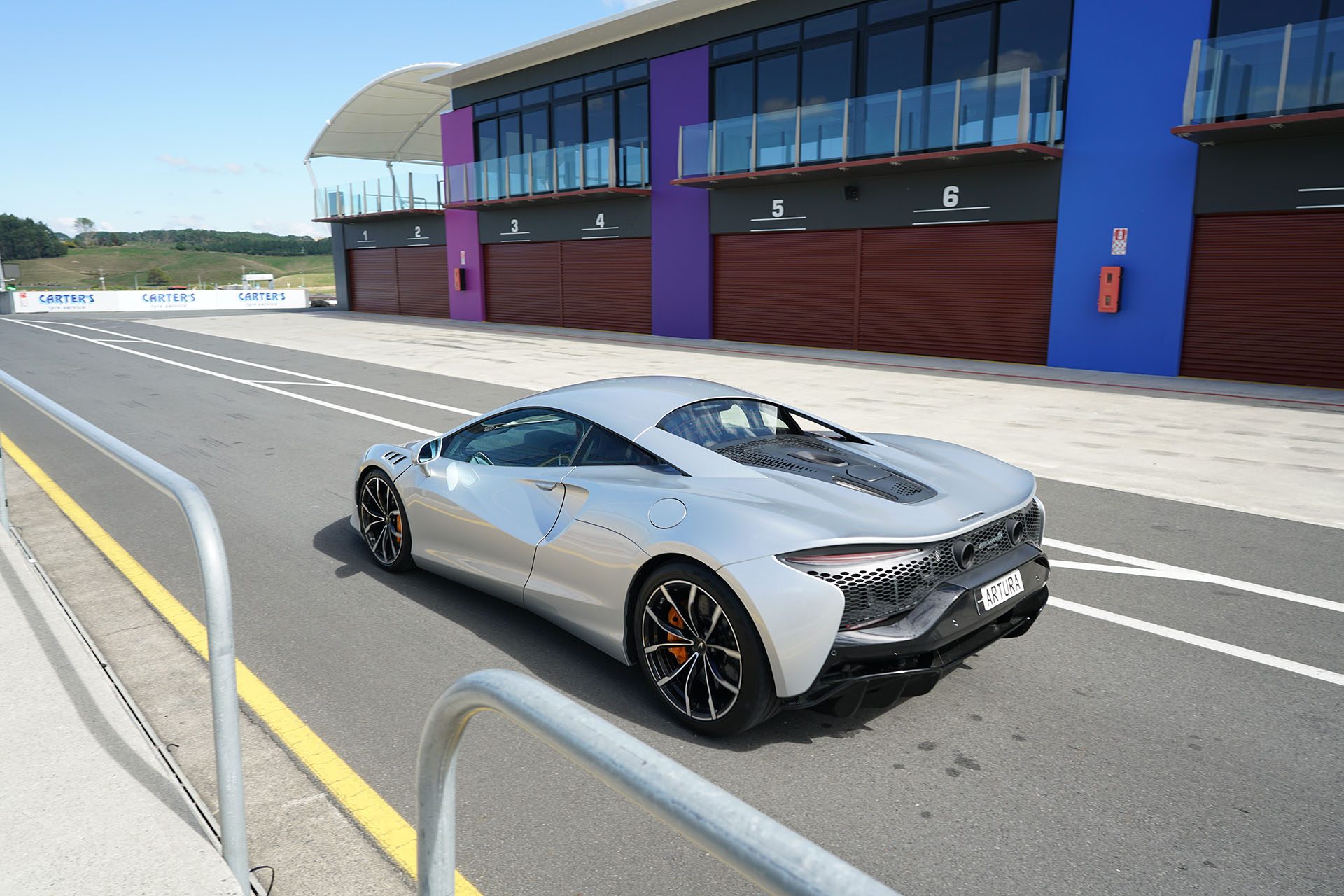 McLaren Artura makes its way silently to the start line under electric power only.