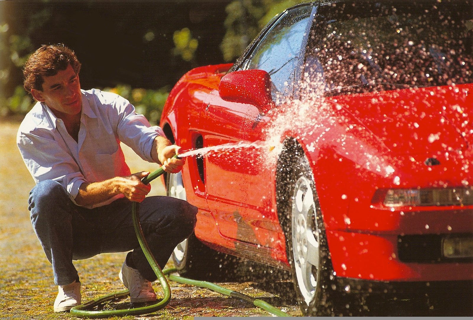 The original owner washing his pride and joy.