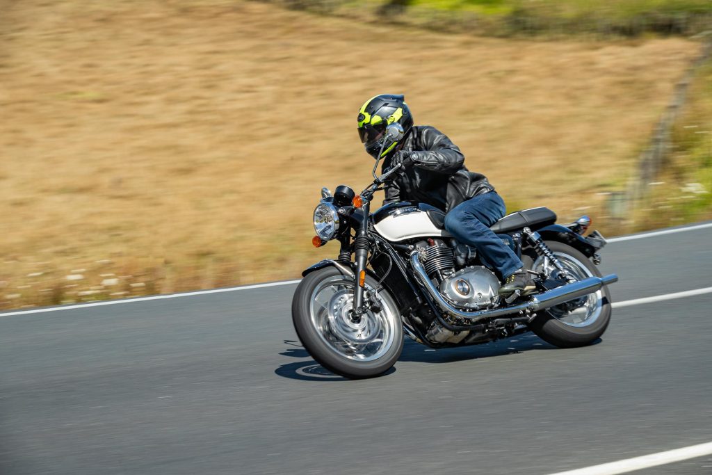 Triumph Bonneville T120 cornering at pace, front angle