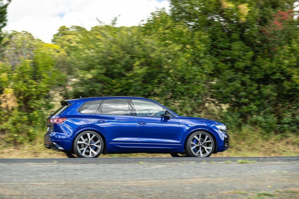 Side profile panning shot of the Volkswagen Touareg R PHEV