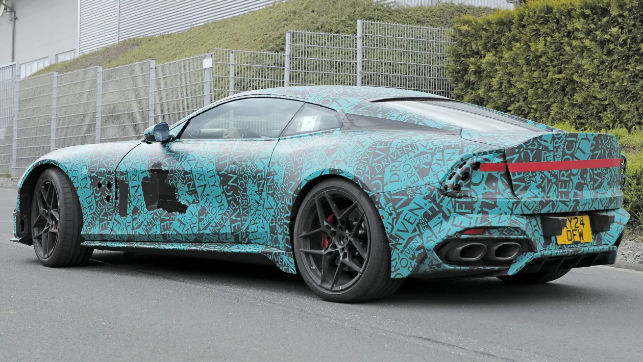 Rear three-quarter shot of Vanquish prototype on road.