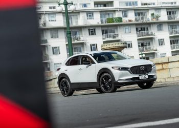 Mazda CX-30 SP25 action cornering shot, in Auckland CBD