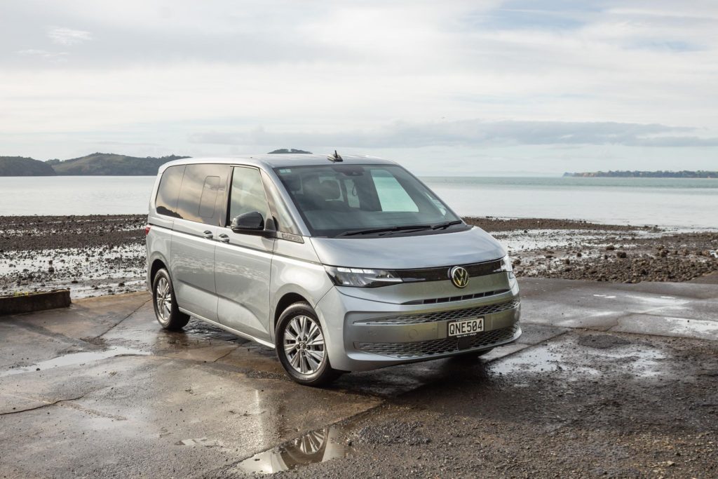 VW Multivan parked by the sea, front quarter angle