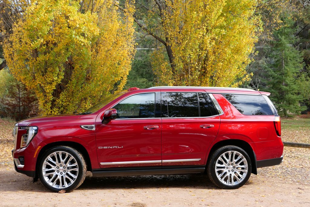 Huge wheels, boxy styling and chrome bits dominate the profile.