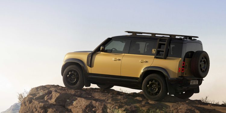 Defender Trophy Edition under clear skies on a rock