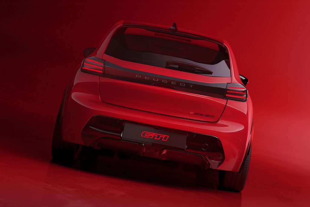 Rear spoiler and diffuser, plus the big badge mark out the hot e208.