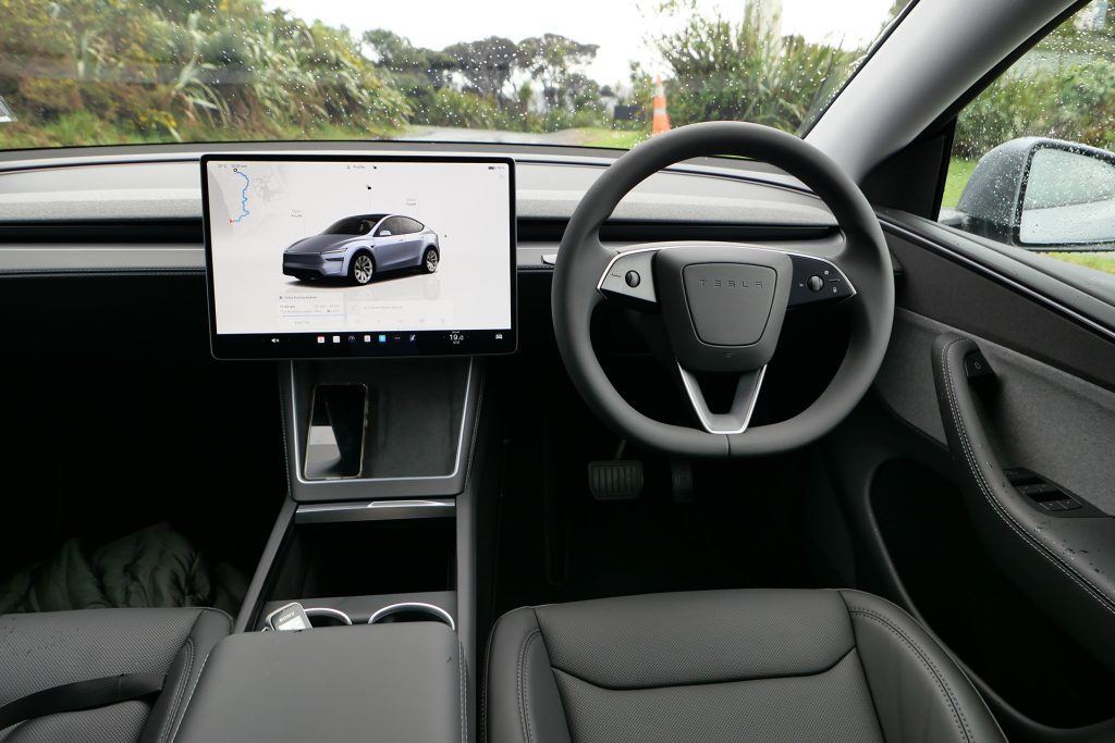 Still with the minimalist look but lots of cubby space, new Tesla steering wheel.