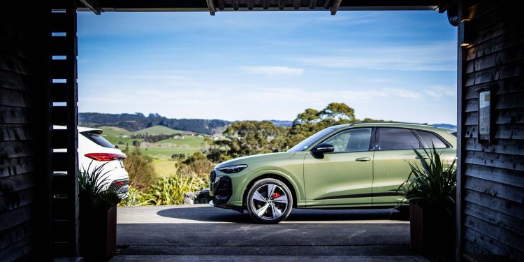 Audi Q5 in green with the countryside in the background