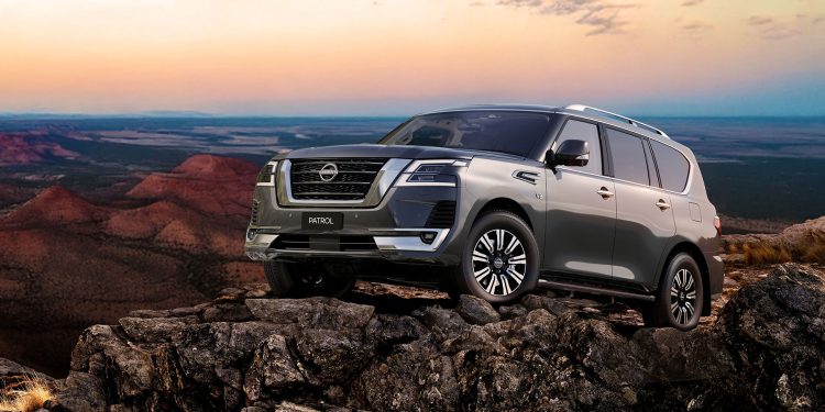 Nissan Patrol on rocks under a clear sky