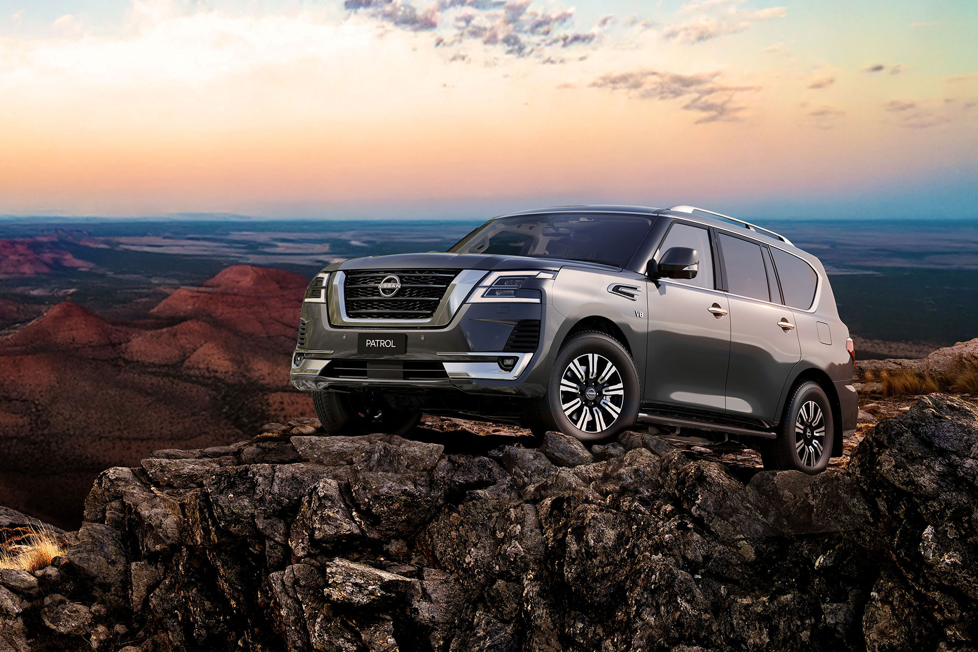 Nissan Patrol on rocks under a clear sky
