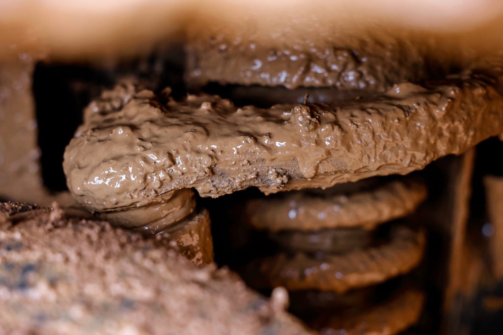 Spring caked in muck.