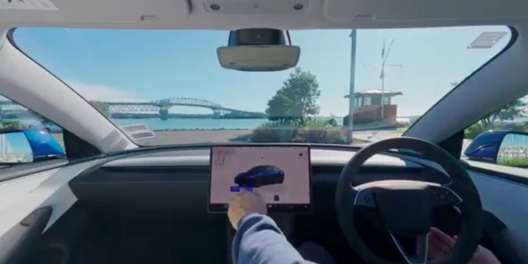 View of Auckland harbour bridge from a Tesla
