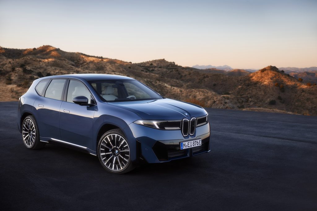 Blue BMW iX3 on black tarmac