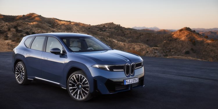 Blue BMW iX3 on black tarmac