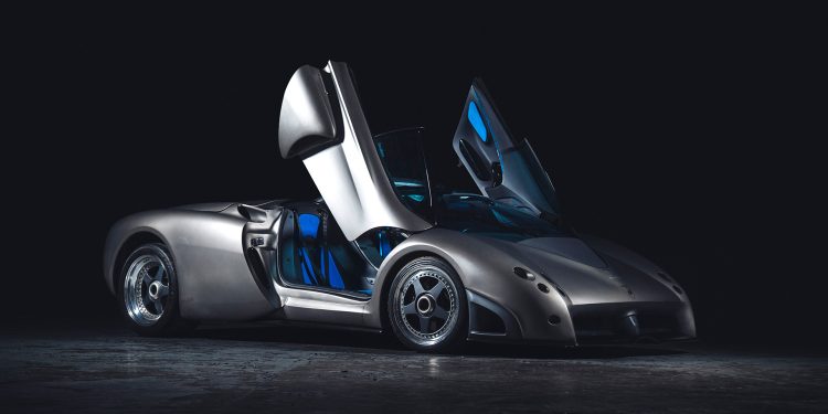 Lamborghini Pregunta with its doors up on a black back ground