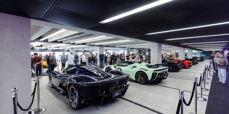 line up of supercars under light