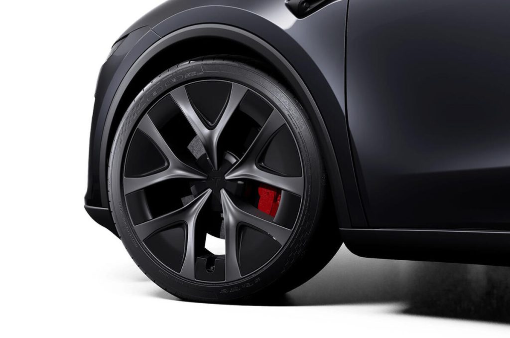 Meaty wheels with low profile rubber and enhanced brakes with red calipers mark out the Tesla Model Y Performance.
