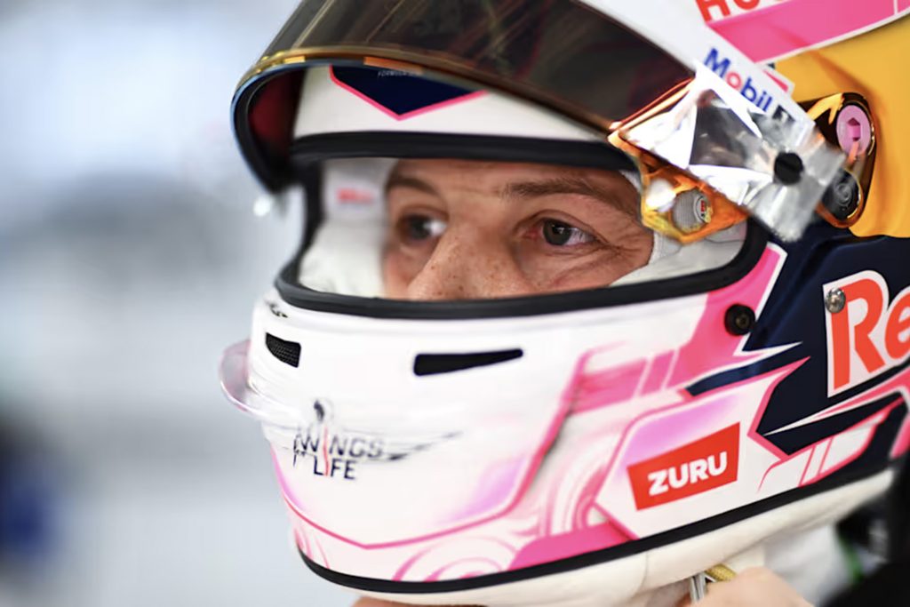 Liam Lawson with pink helmet.