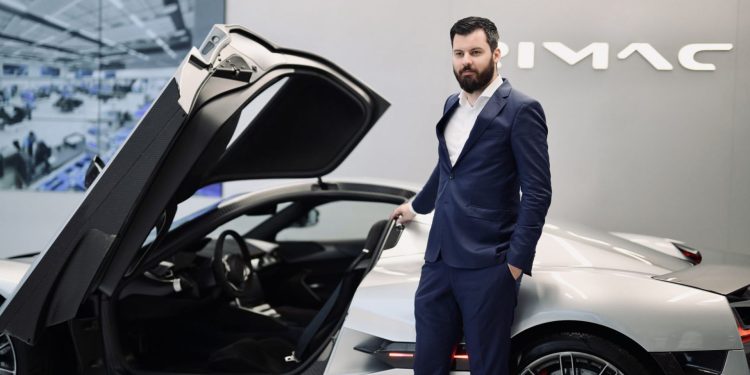 Mate Rimac next to a Rimac