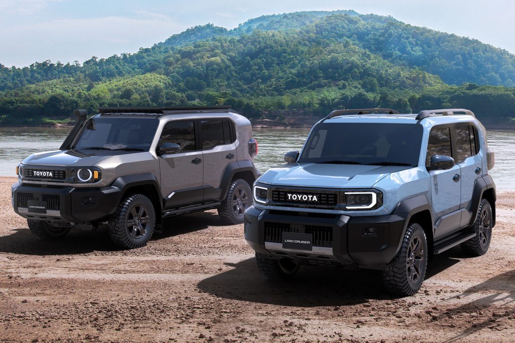 Two Toyota FJ models on the banks of a river