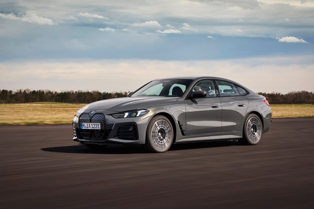 BMW i4 on tarmac under cloudy skies